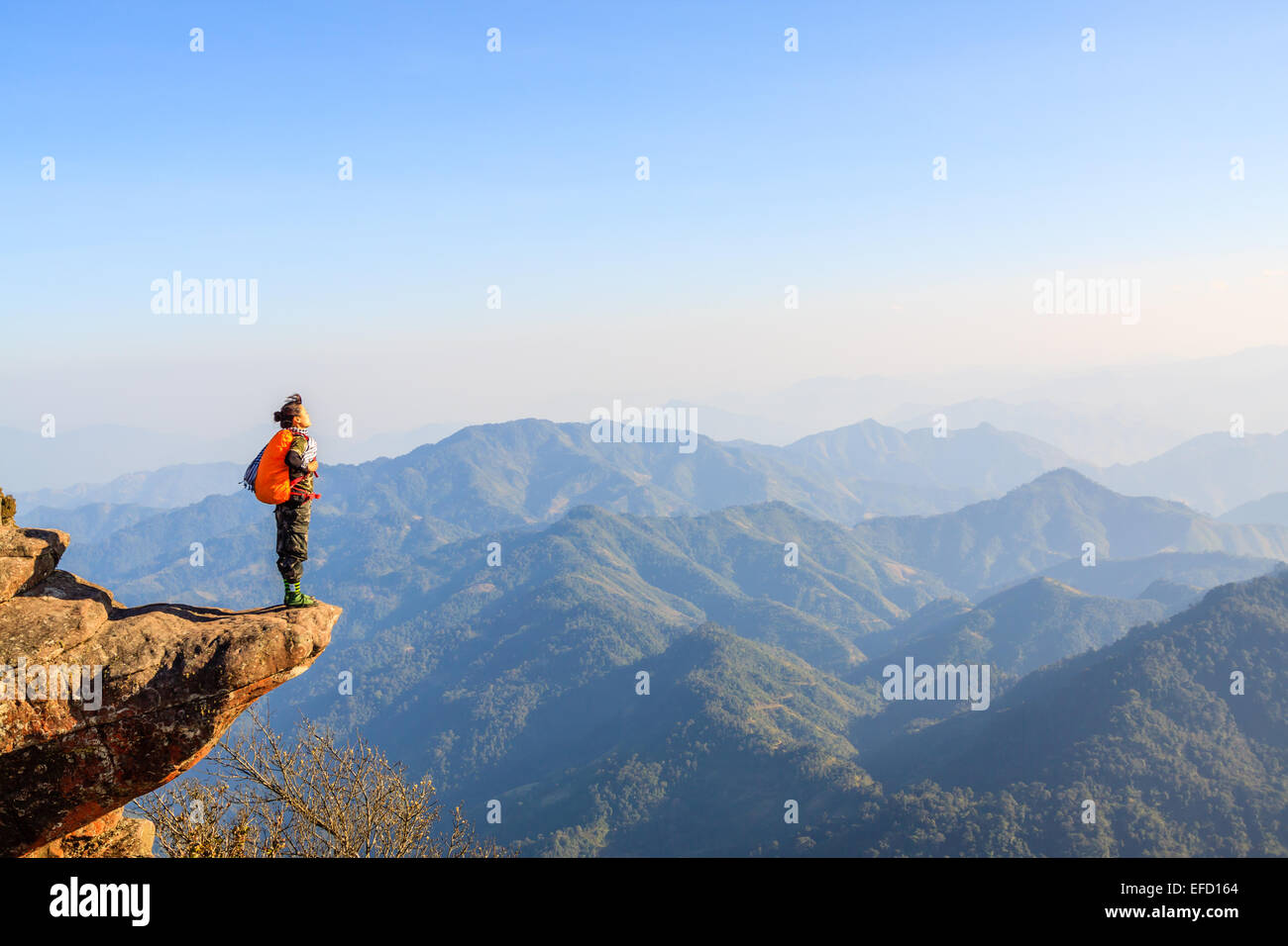Women on the edge of a cliff Stock Photo