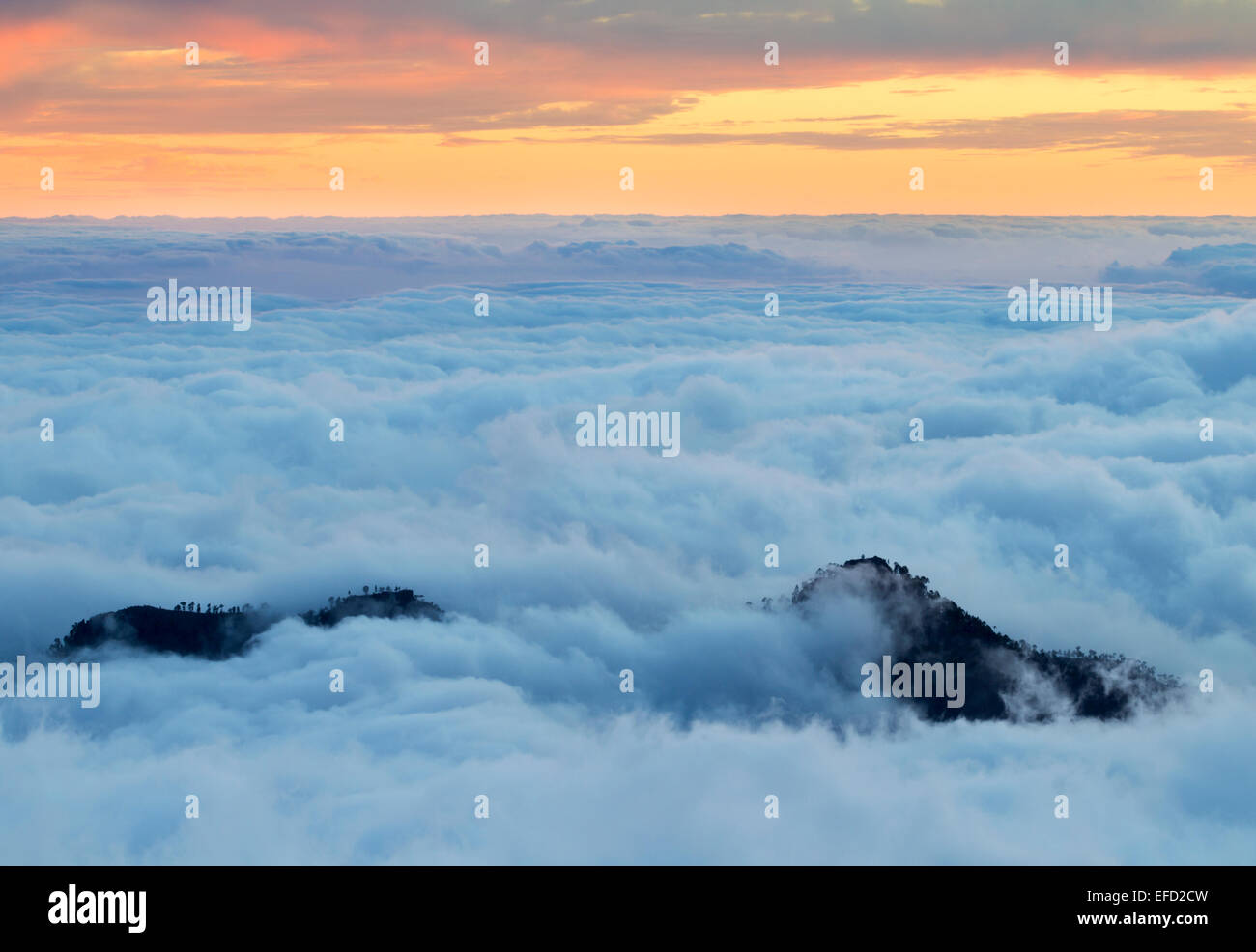 A spectacular sunset with cloud inversion from the highest point on Gran Canaria, Canary Islands, Spain. Stock Photo