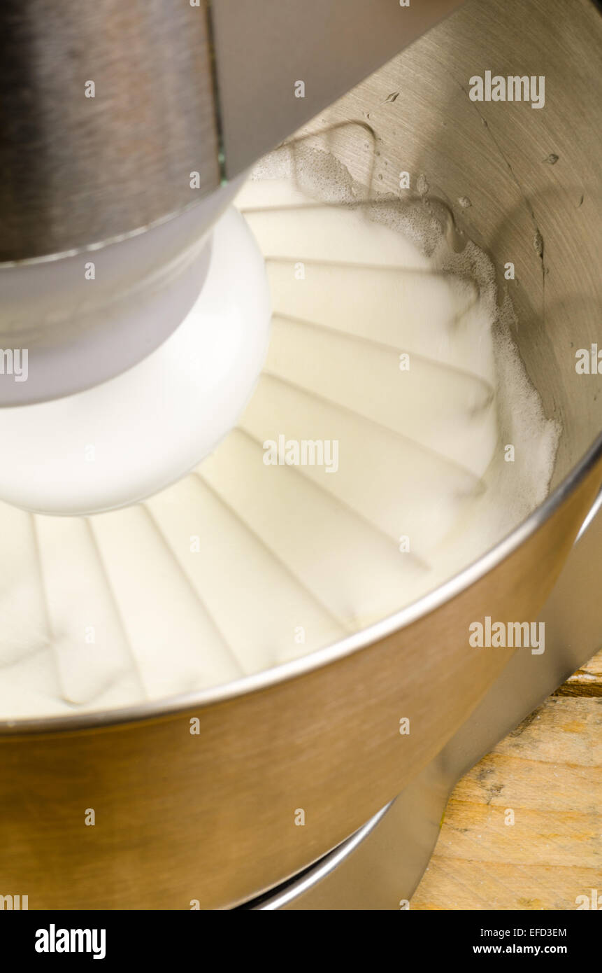 Egg whites being whisked inside a modern food processor Stock Photo Alamy