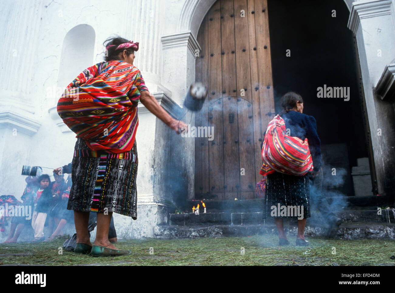 Several women burn incense during the celebration of Mass Stock Photo Alamy