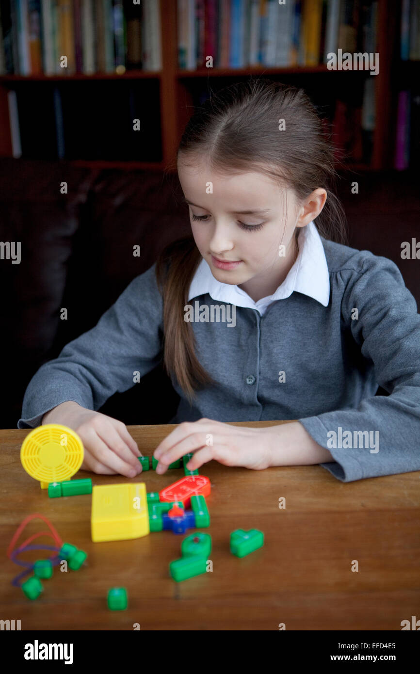 Child learning about electronics circuits assembly. Stock Photo