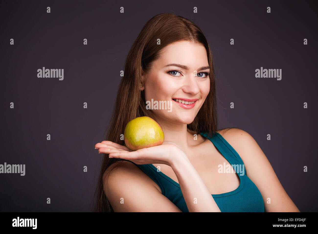 Woman holding apple Stock Photo