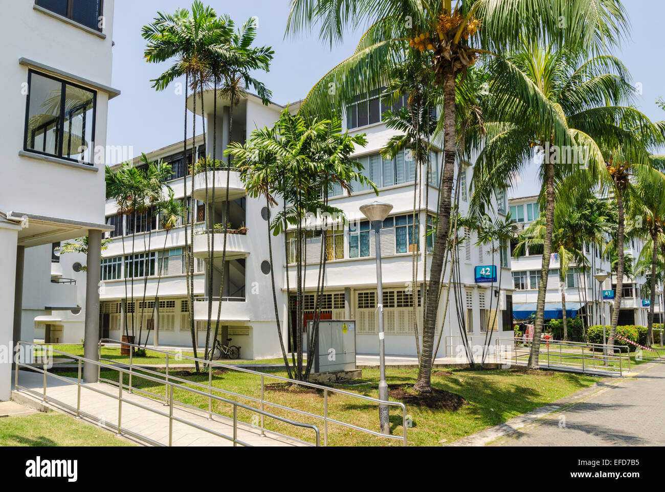 Palm trees gardens and post-war four-storey blocks of flats in the Tiong Bahru Estate, Singapore Stock Photo
