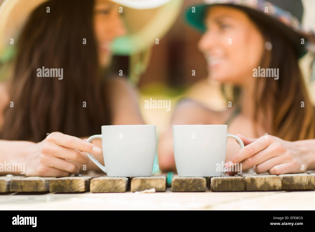 Young women relaxing in the pool Stock Photo - Alamy