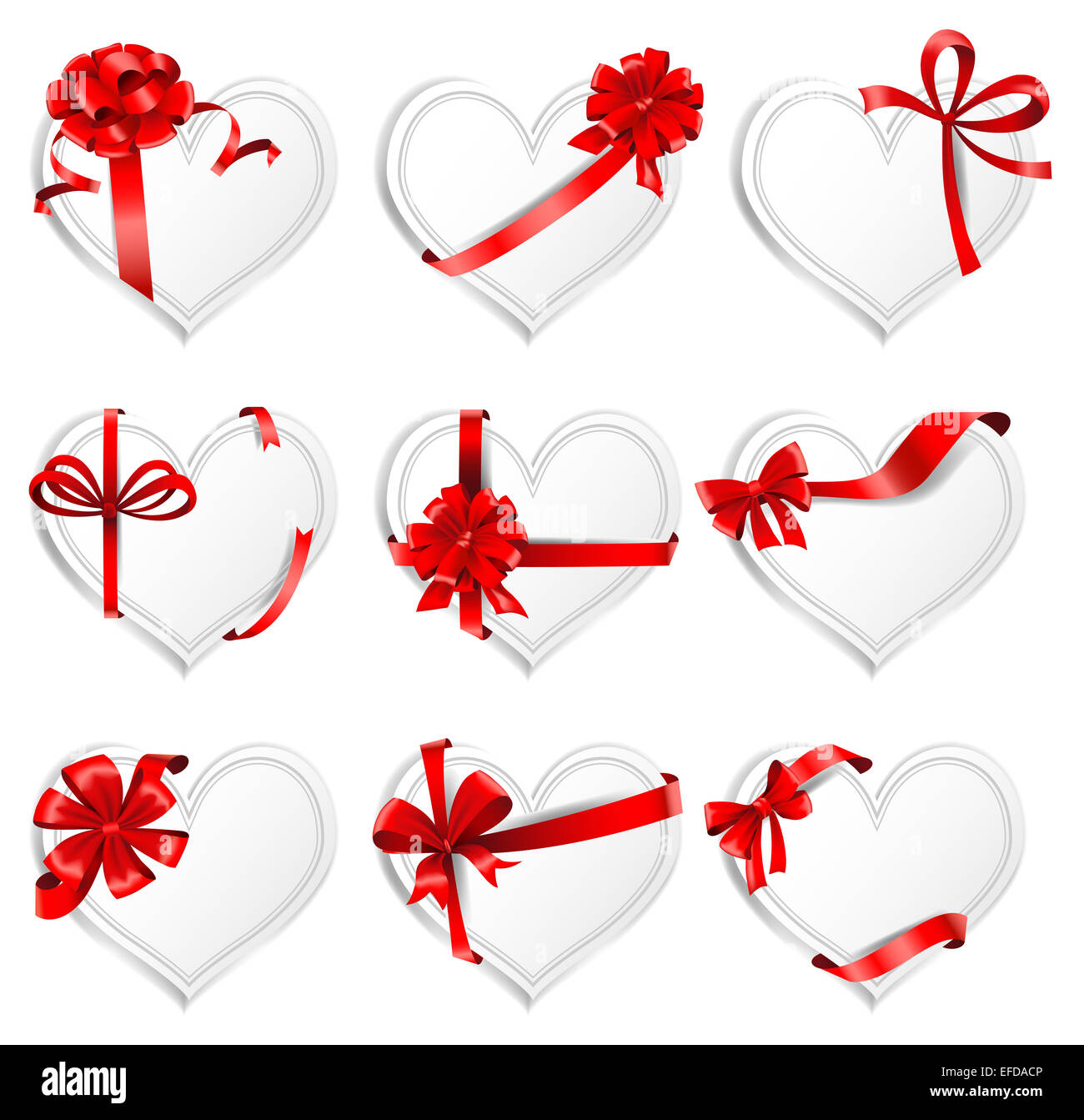 Festive heart-shaped  cards with red gift ribbons. Stock Photo