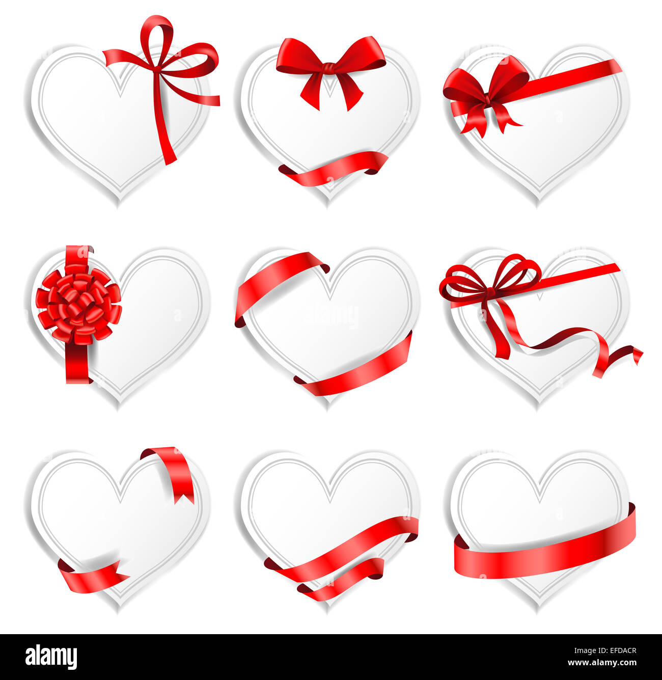 Festive heart-shaped  cards with red gift ribbons. Stock Photo