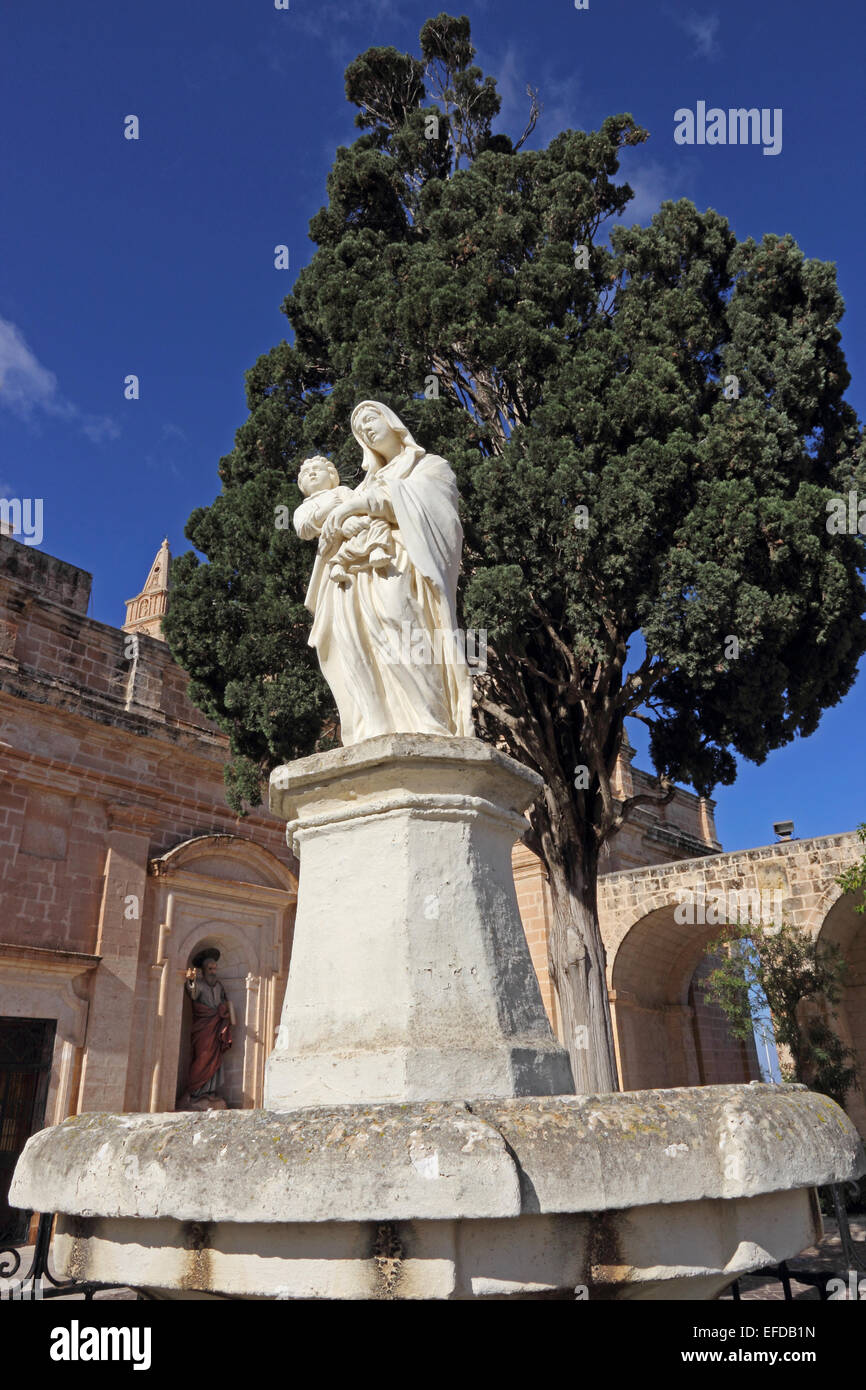 Statue of Virgin and child in grounds of Parish Church, Mellieha, Malta Stock Photo