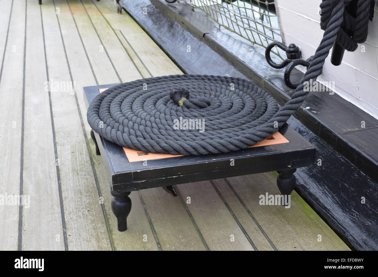 Sailing ship's rigging rope coiled on the deck Stock Photo - Alamy