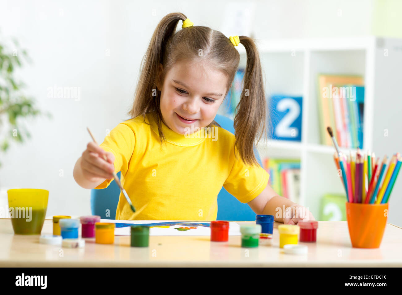 Cute Child Girl Painting With Colourful Paints Stock Photo - Alamy