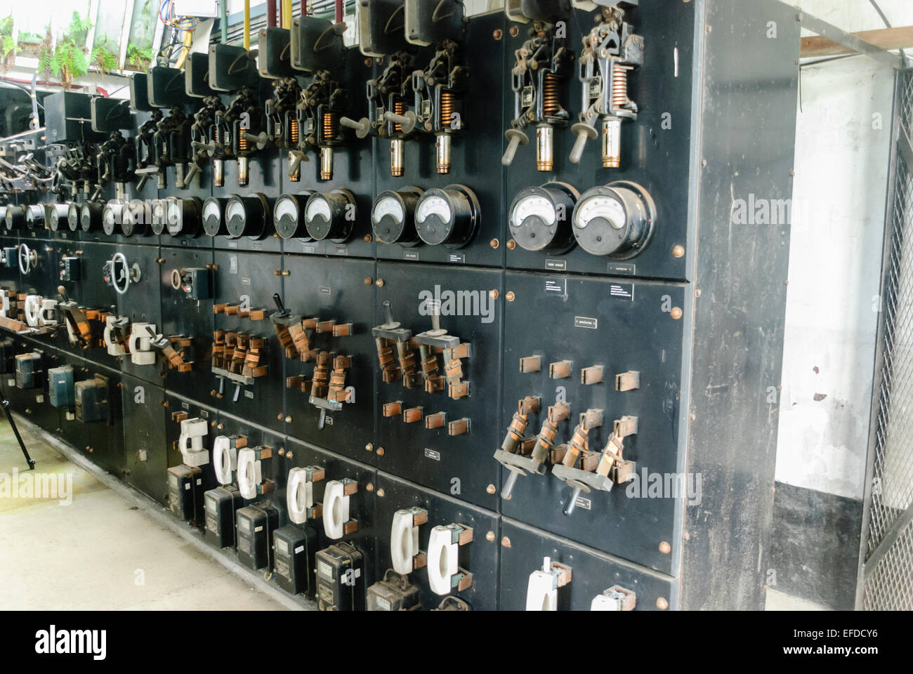 Very old electrical switchgear with gauges and Edison style knife switches Stock Photo