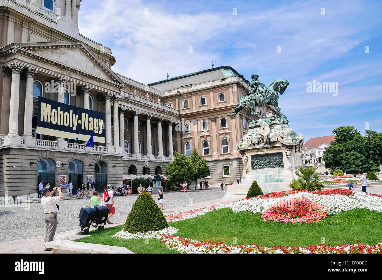 Tourists outside Buda Castle museum, Budapest, with the statue of Prince Eugene of Savoy Stock Photo