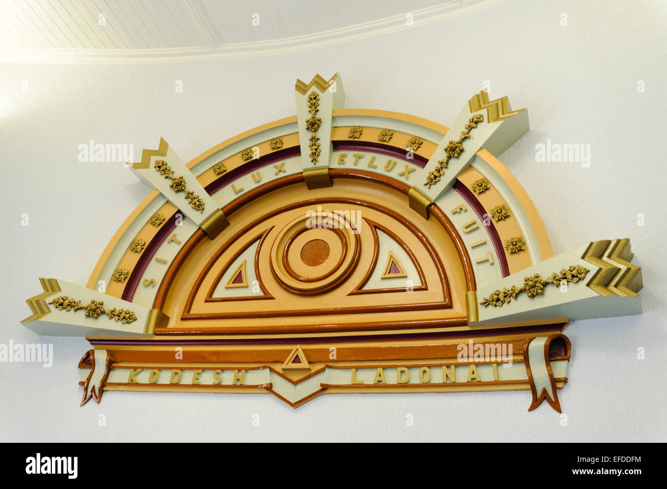Inscription above a door in a masonic hall 'Sit lux et lux fuit' (Let there be light, and there was light) Stock Photo