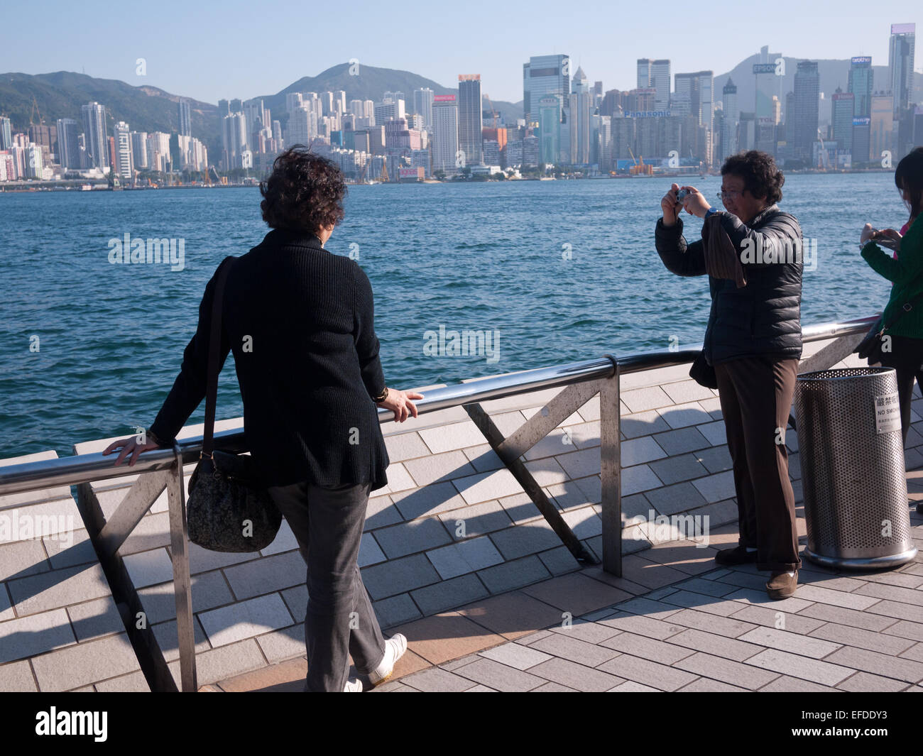 Hong Kong 2015 -  Promenade tourists taking photos Stock Photo