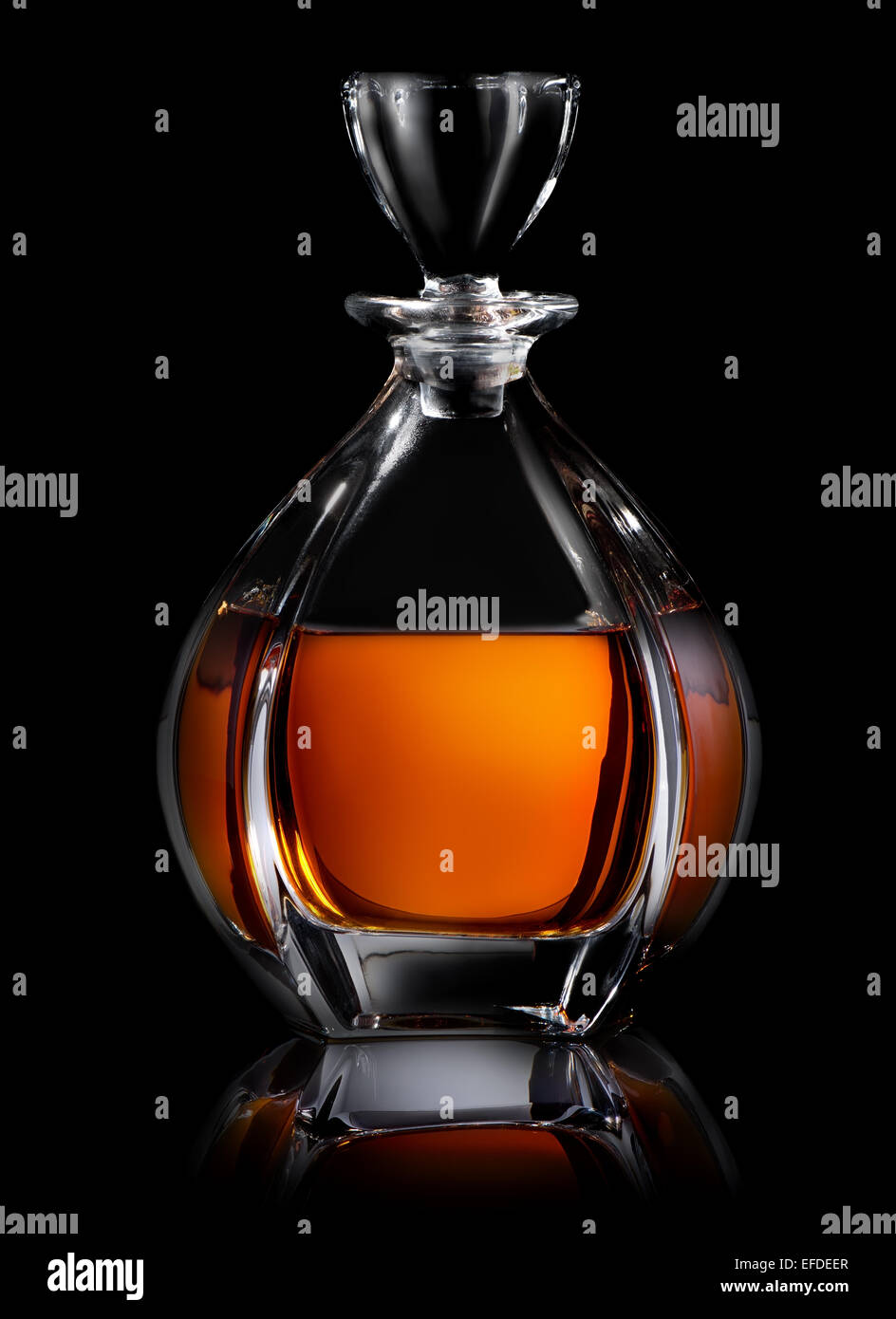 Decanter of cognac on a black background Stock Photo