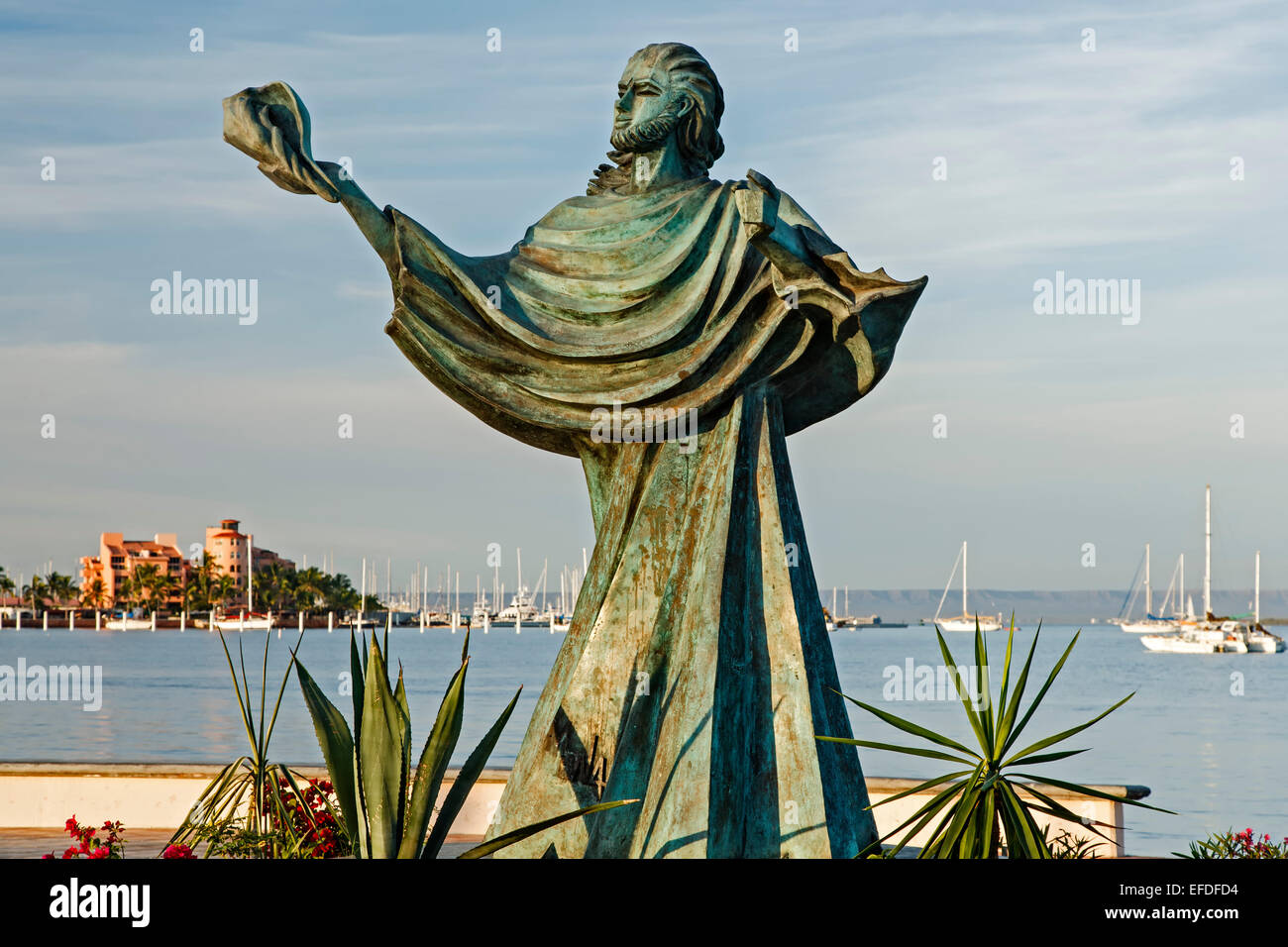 Sculpture of person holding a shell and bay,  Malecon (seaside promenade), La Paz, Baja California Sur, Mexico Stock Photo
