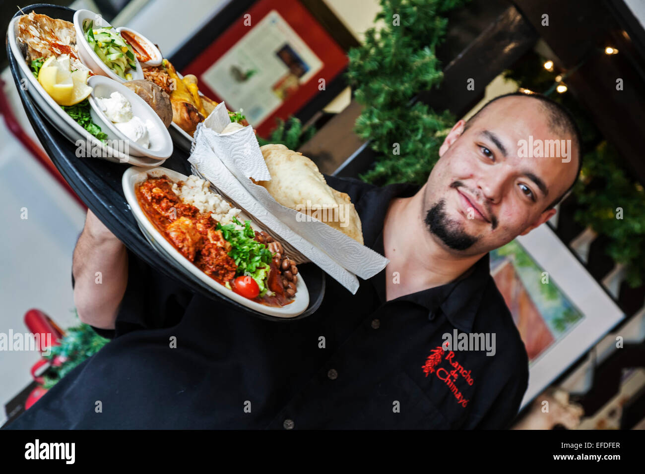 Server carrying food tray, Rancho de Chimayo Restaurant, Chimayo, New