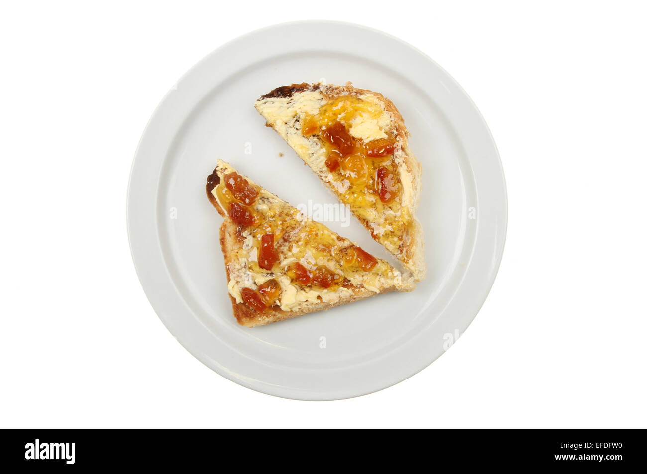 Buttered toast with marmalade on a plate isolated against white Stock Photo