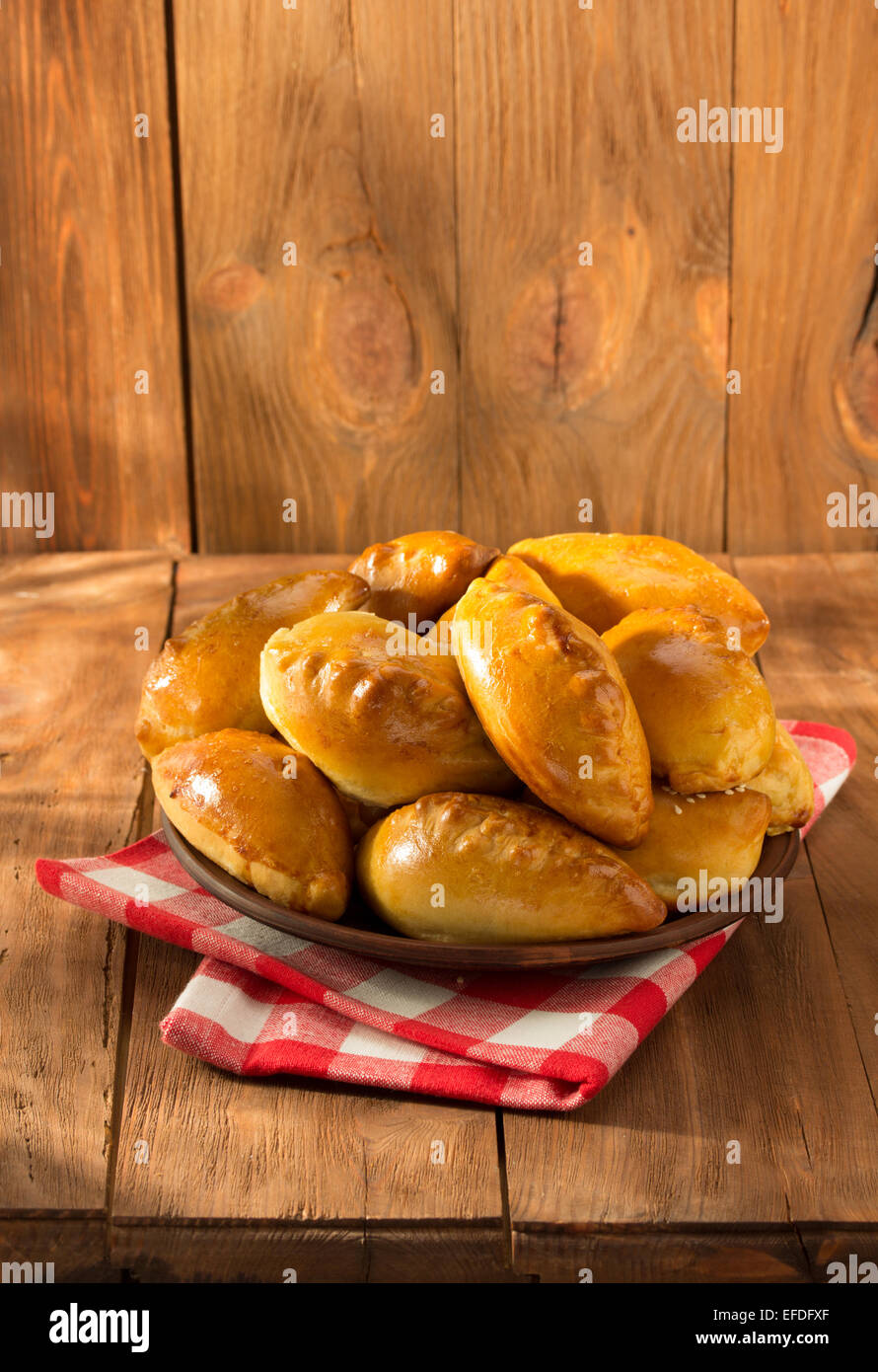 tasty pastry on plate at wooden background Stock Photo - Alamy