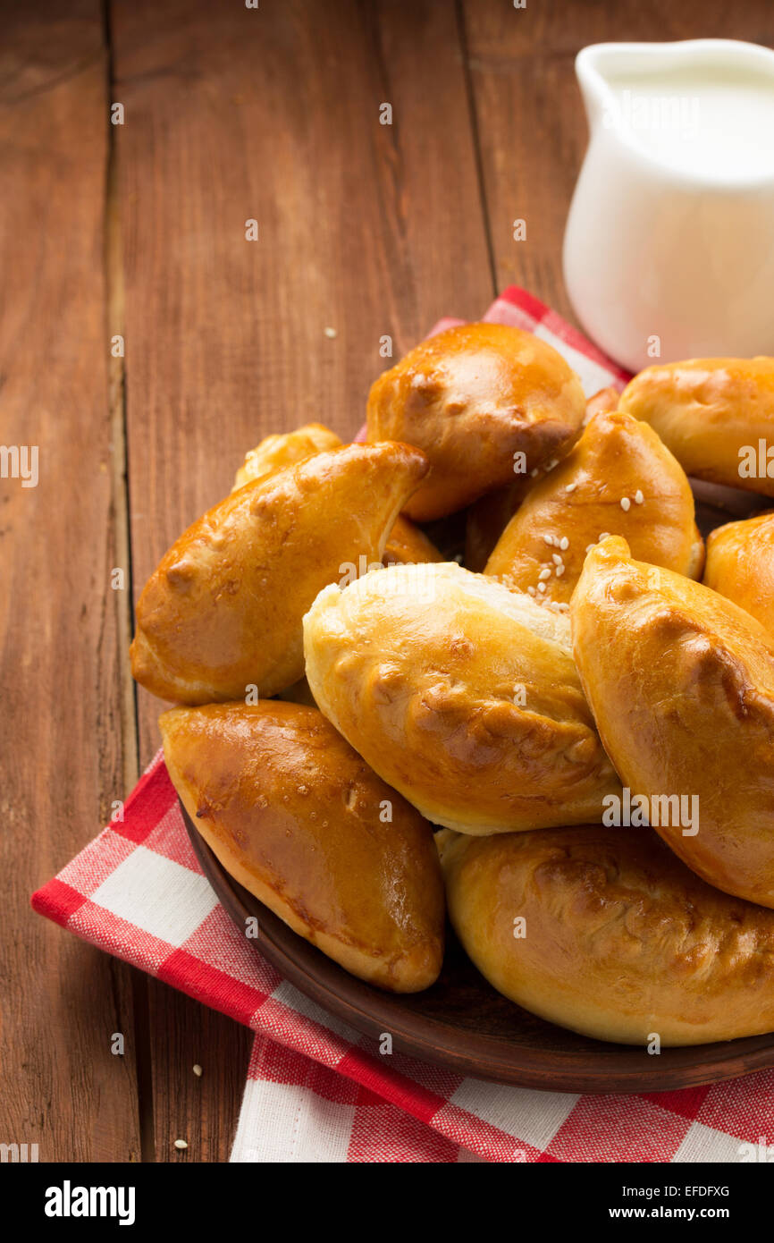 tasty pastry on plate at wooden background Stock Photo - Alamy