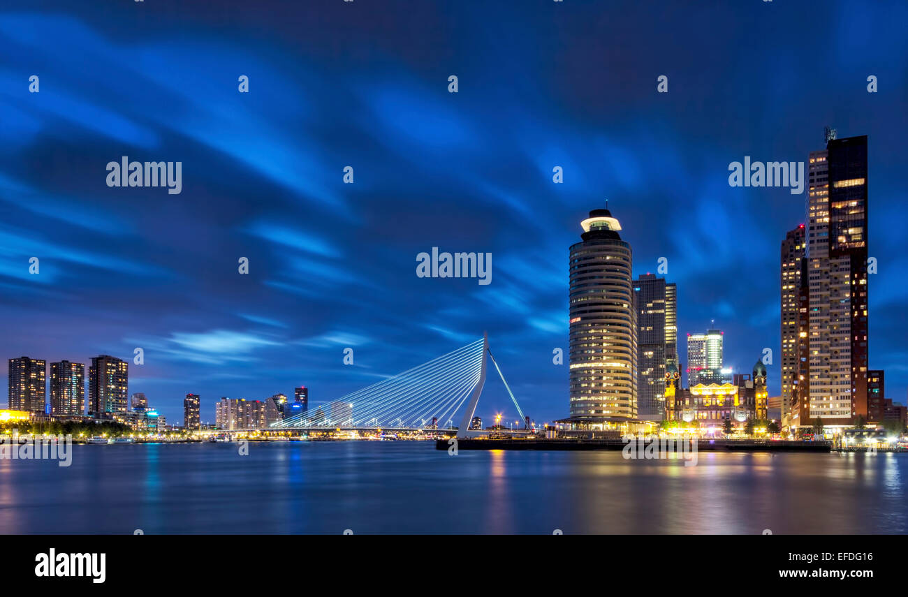 Rotterdam skyline during the blue hour. With the Erasmus bridge, Holland-America Line, New orleans and the Montevideo Buildings Stock Photo
