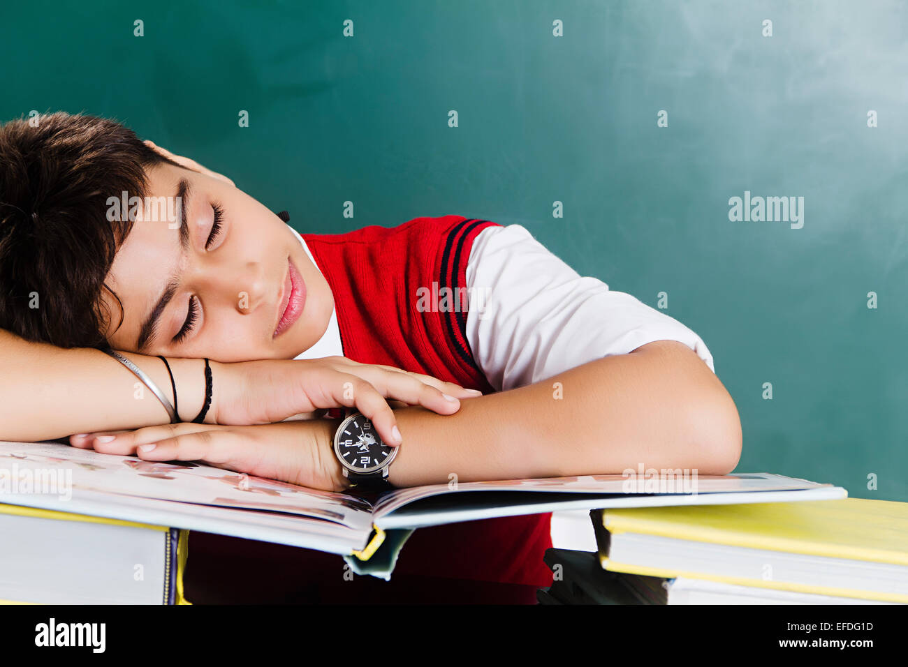 1 indian school boy student sleeping book Study Stock Photo