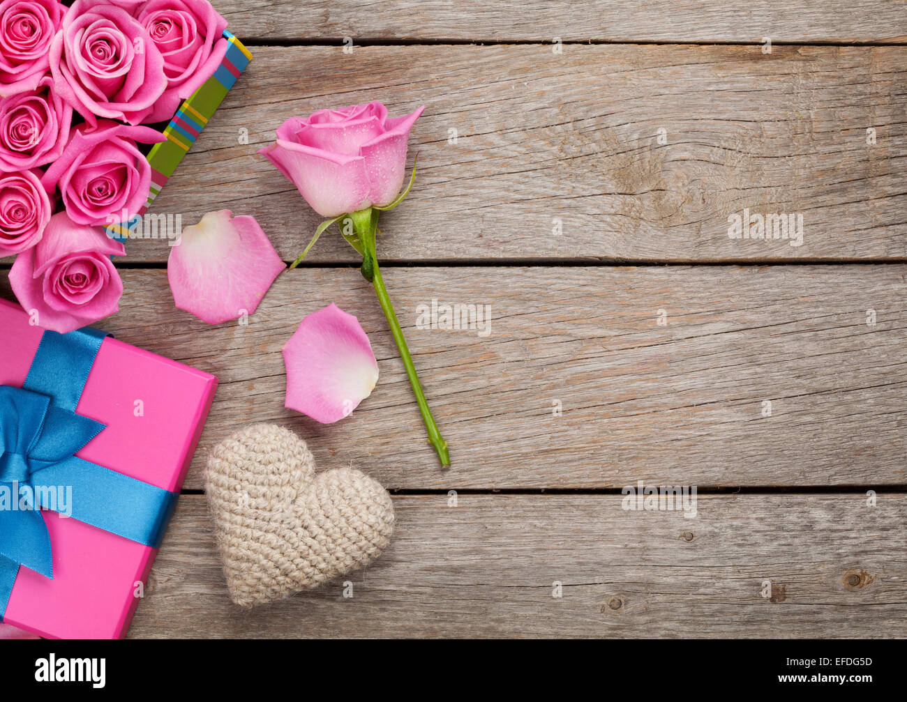 Valentines day background with gift box full of pink roses and ...