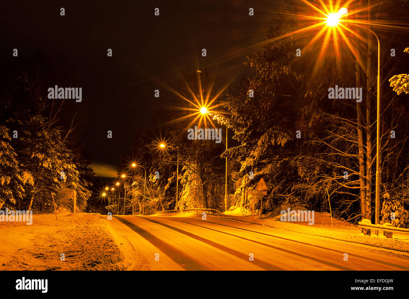 Winter road in the forest Stock Photo - Alamy
