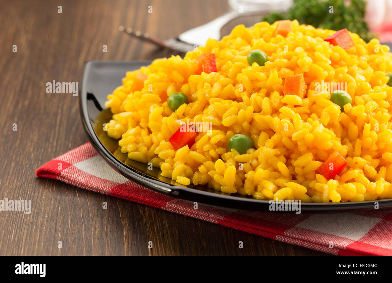 bowl full of rice on wooden background Stock Photo - Alamy