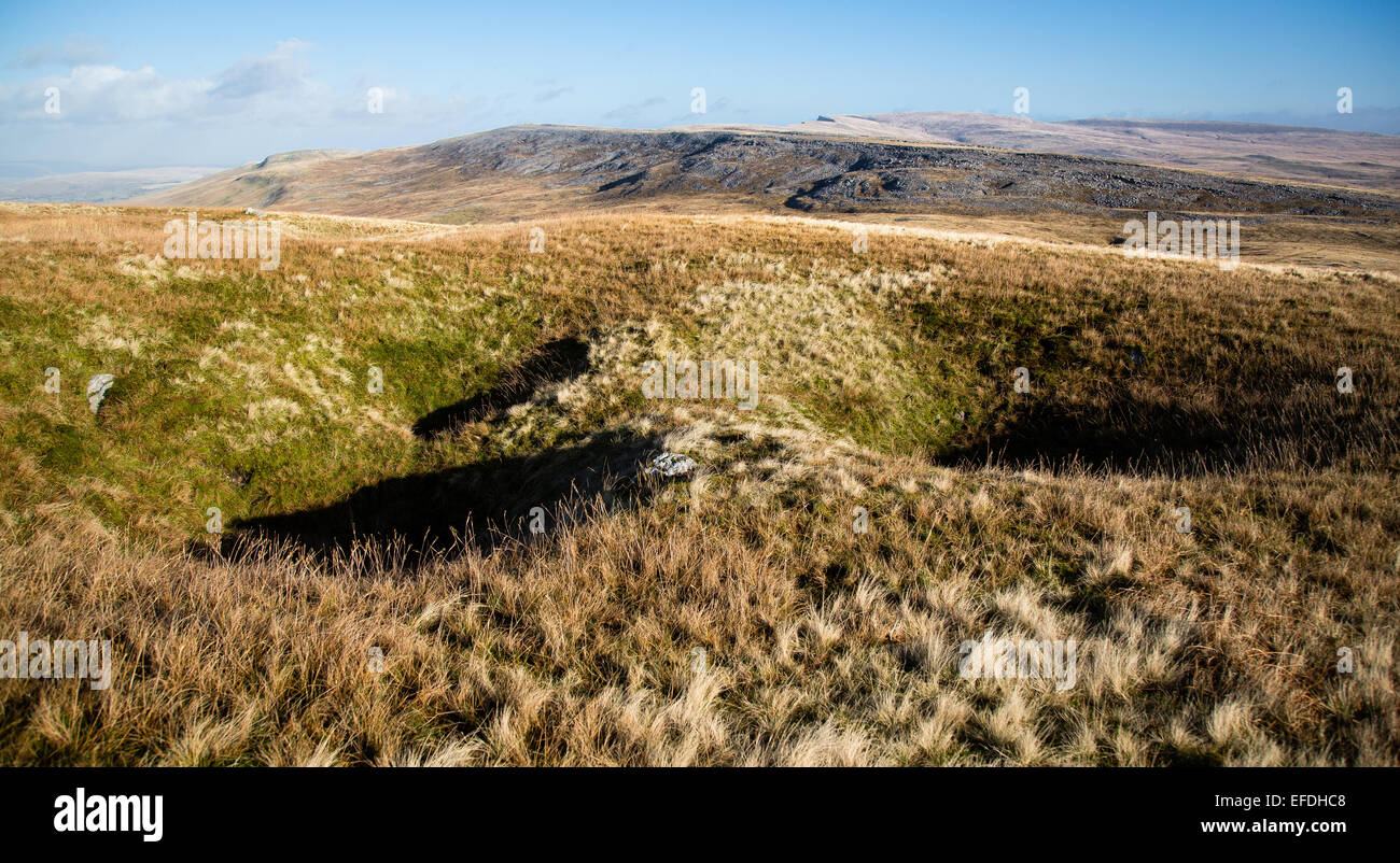 Sink holes or shake holes in the moorland landscape of the Black Mountains area of the Brecon Beacons Wales UK Stock Photo