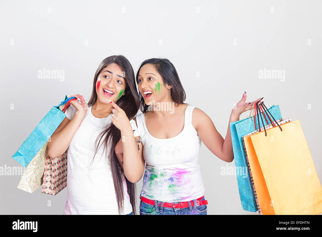 2 indian ladies Holi Festival Shopping Stock Photo