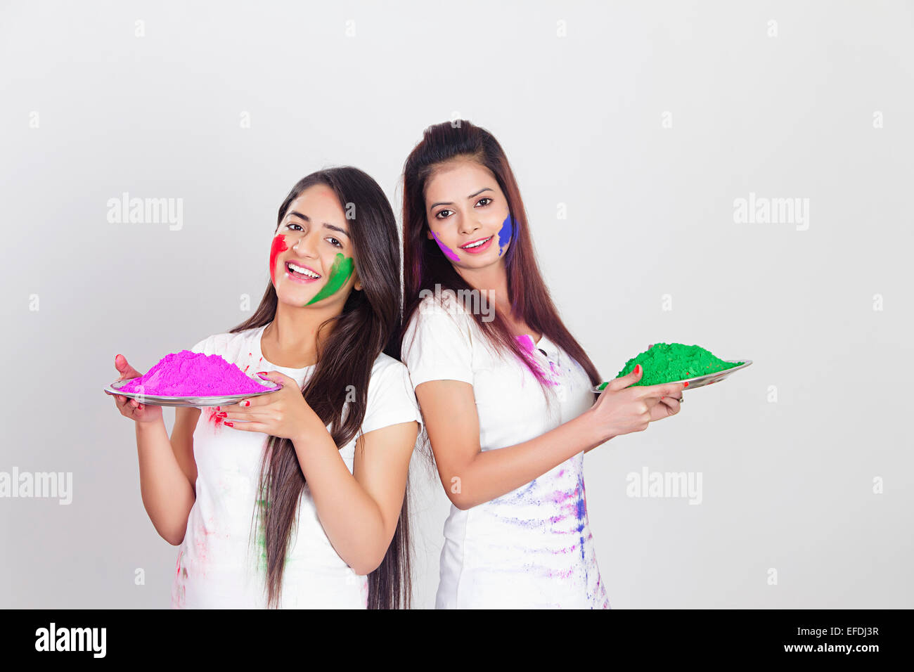 2 indian ladies Holi Festival Greeting Stock Photo