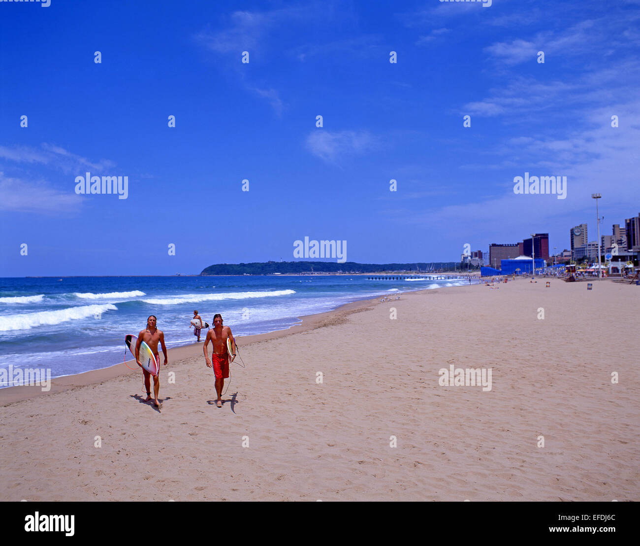 Surfers on 'The Golden Mile' beachfront, Durban, KwaZulu-Natal province, South Africa Stock Photo