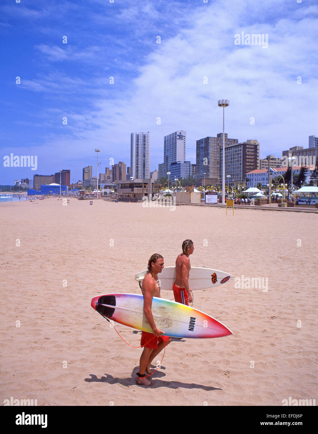 Surfers on 'The Golden Mile' beachfront, Durban, KwaZulu-Natal province, South Africa Stock Photo
