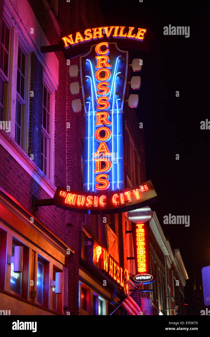 A night shot of the neon sign for Nashville Crossroads, a music venue on lower Broadway in Downtown Nashville, TN Stock Photo
