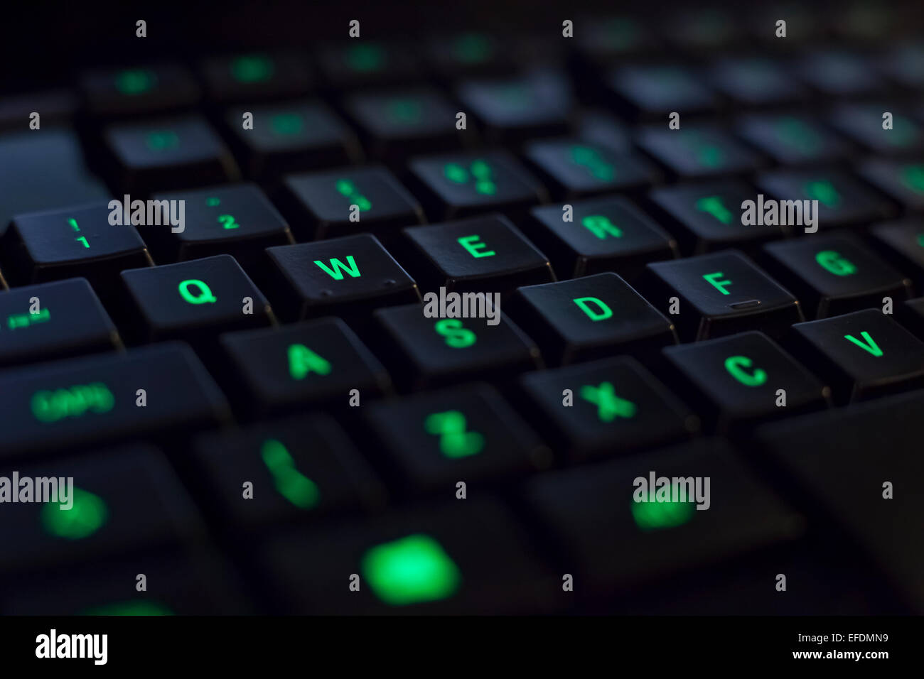 Green back lit gaming keyboard wasd Stock Photo