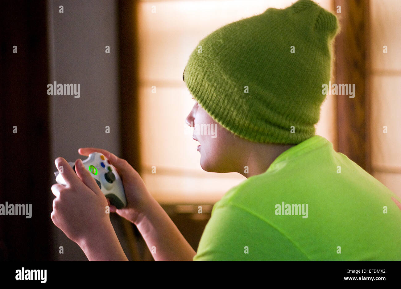 Child playing X-Box or Video game. Playstation Stock Photo