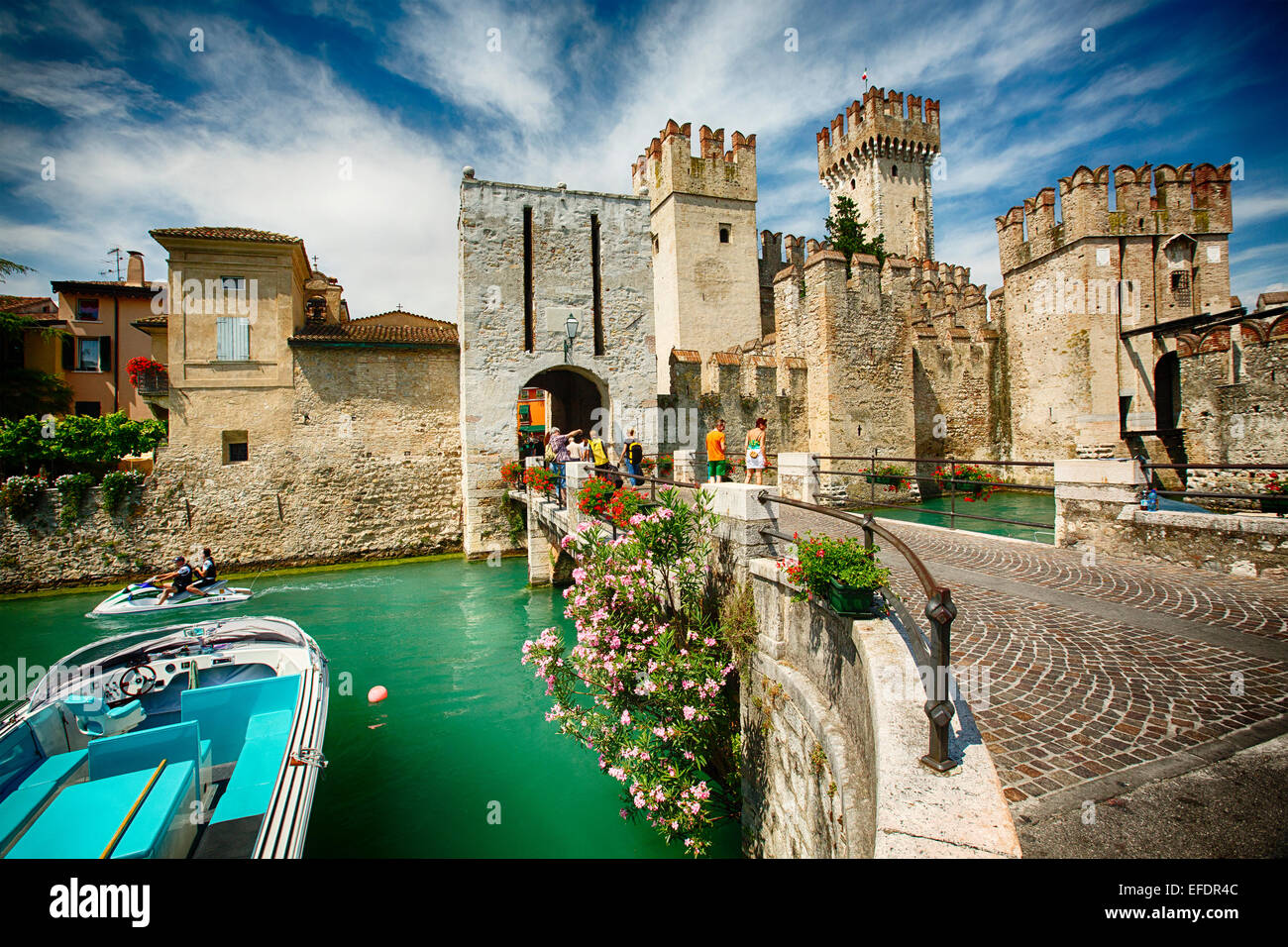View of a Castle in the Lake, Scaliger Castle, Sirmione, Lake Garda, Lombardy, Italy Stock Photo