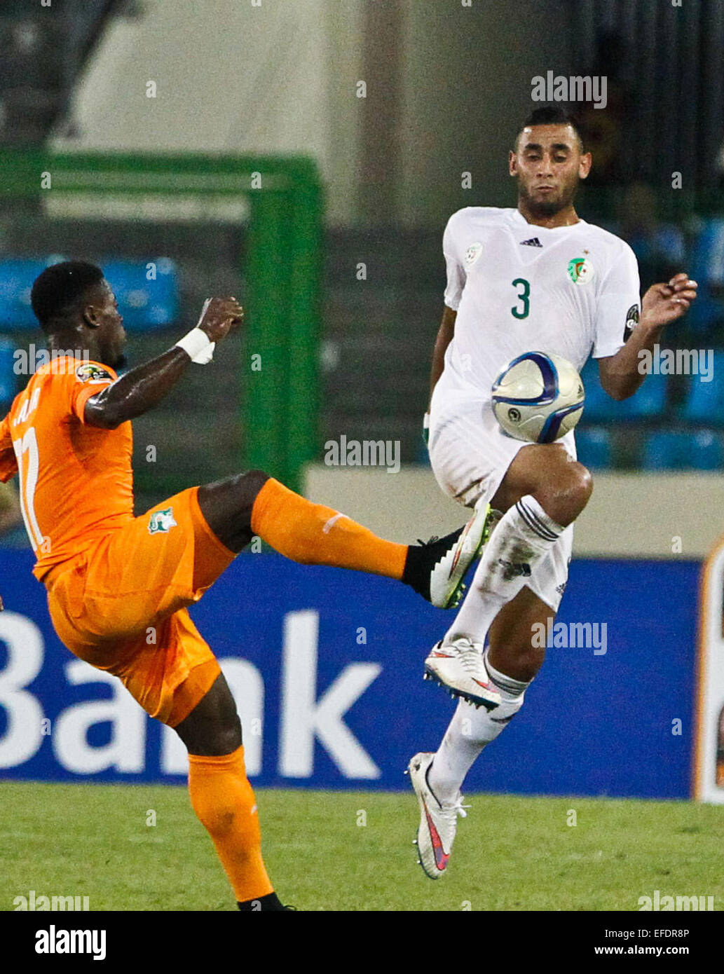 Malabo, Equatorial Guinea. 1st Feb, 2015. Faouzi Ghoulam (R) of Algeria competes during a quarterfinal match of Africa Cup of Nations against Cote d'Ivoire in Malabo, Equatorial Guinea, Feb. 1, 2015. Cote d'Ivoire won 3-1. Credit:  Li Jing/Xinhua/Alamy Live News Stock Photo