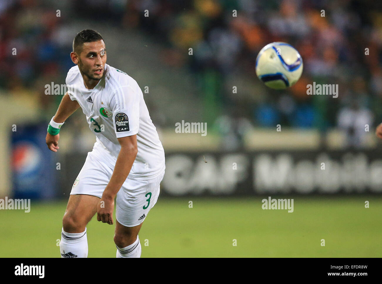 Malabo, Equatorial Guinea. 1st Feb, 2015. Faouzi Ghoulam of Algeria passes the ball during a quarterfinal match of Africa Cup of Nations against Cote d'Ivoire in Malabo, Equatorial Guinea, Feb. 1, 2015. Cote d'Ivoire won 3-1. Credit:  Meng Chenguang/Xinhua/Alamy Live News Stock Photo