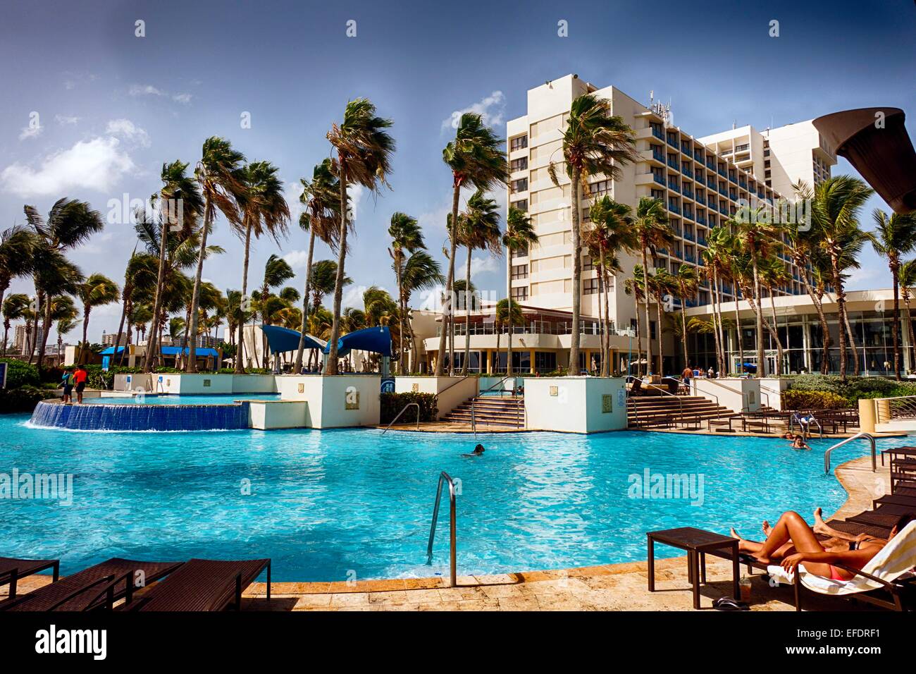 People Relaxing at Poolside, Caribe Hilton, San Juan, Puerto Rico. Stock Photo
