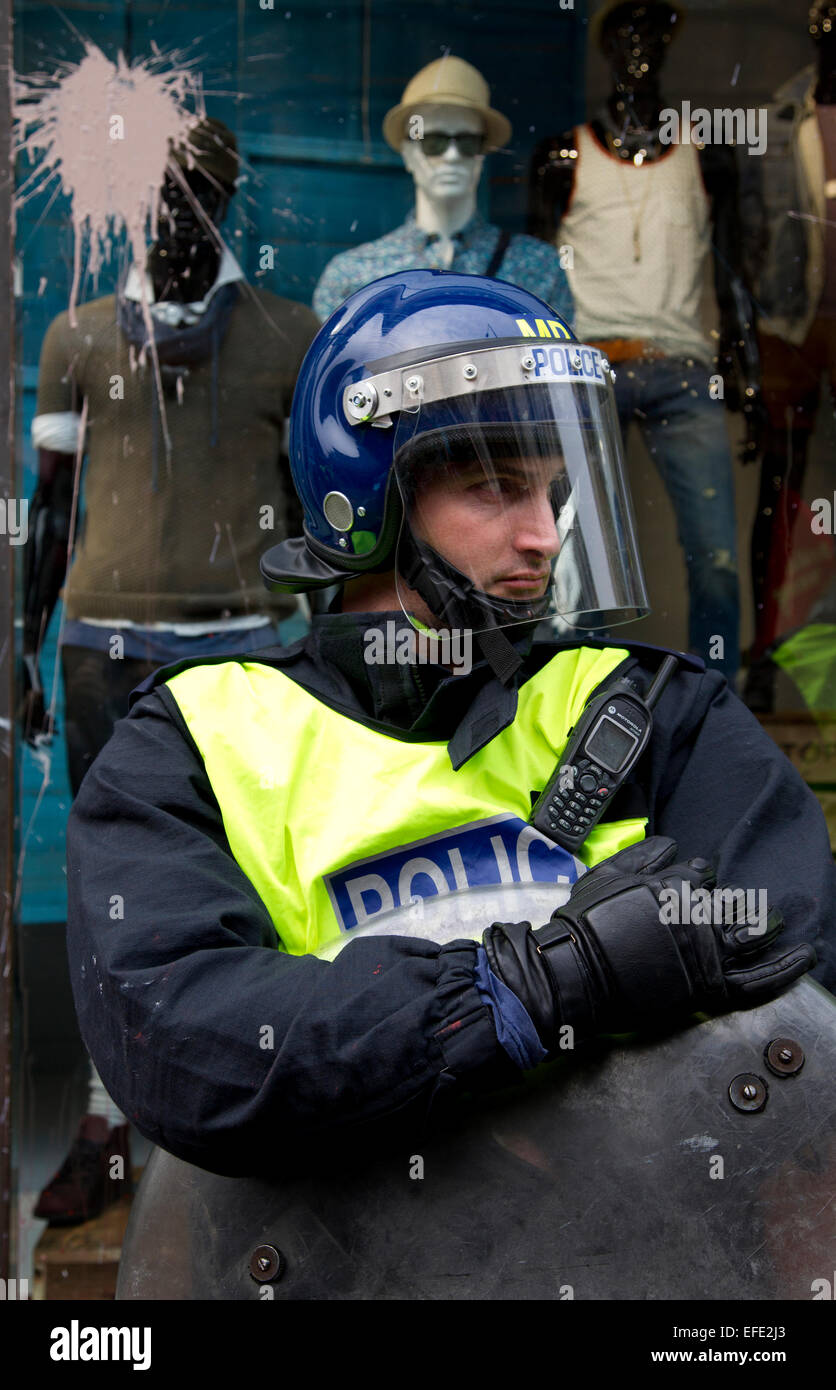Police officer at Oxford Street, London protest against corporate tax avoidance. Stock Photo