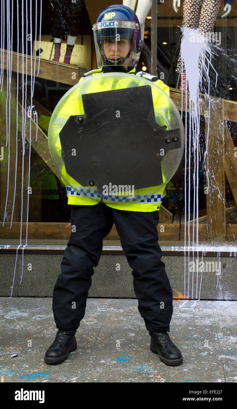 Female police officer in riot gear at Oxford Street branch of Top Shop during 2011 protest against corporate tax avoidance. Stock Photo