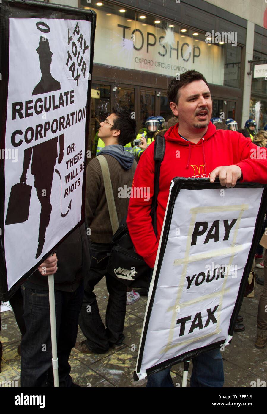 Protester outside Top Shop in Oxford Street during London protest against corporate tax avoidance. Stock Photo