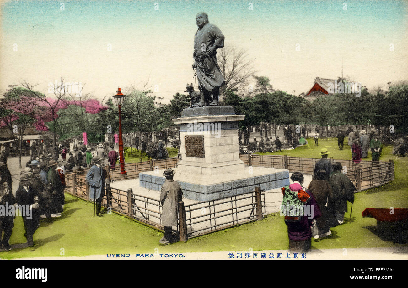Japan, Tokyo. circa 1890-1910 hand coloured postcard. Ueno park with people looking at statue of Saigō Takamori with his dog, dubbed the Last Samurai. Stock Photo