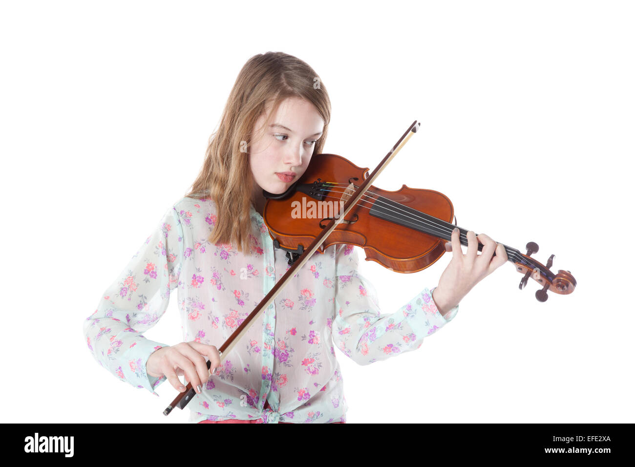 young girl in studio against white background plays the violin Stock ...