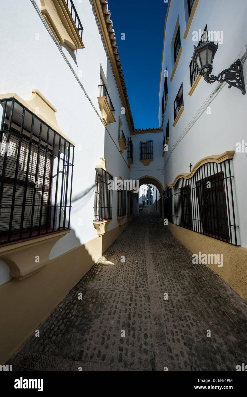 A narrow street in the old town of Ronda, Andalusia, Spain. Stock Photo