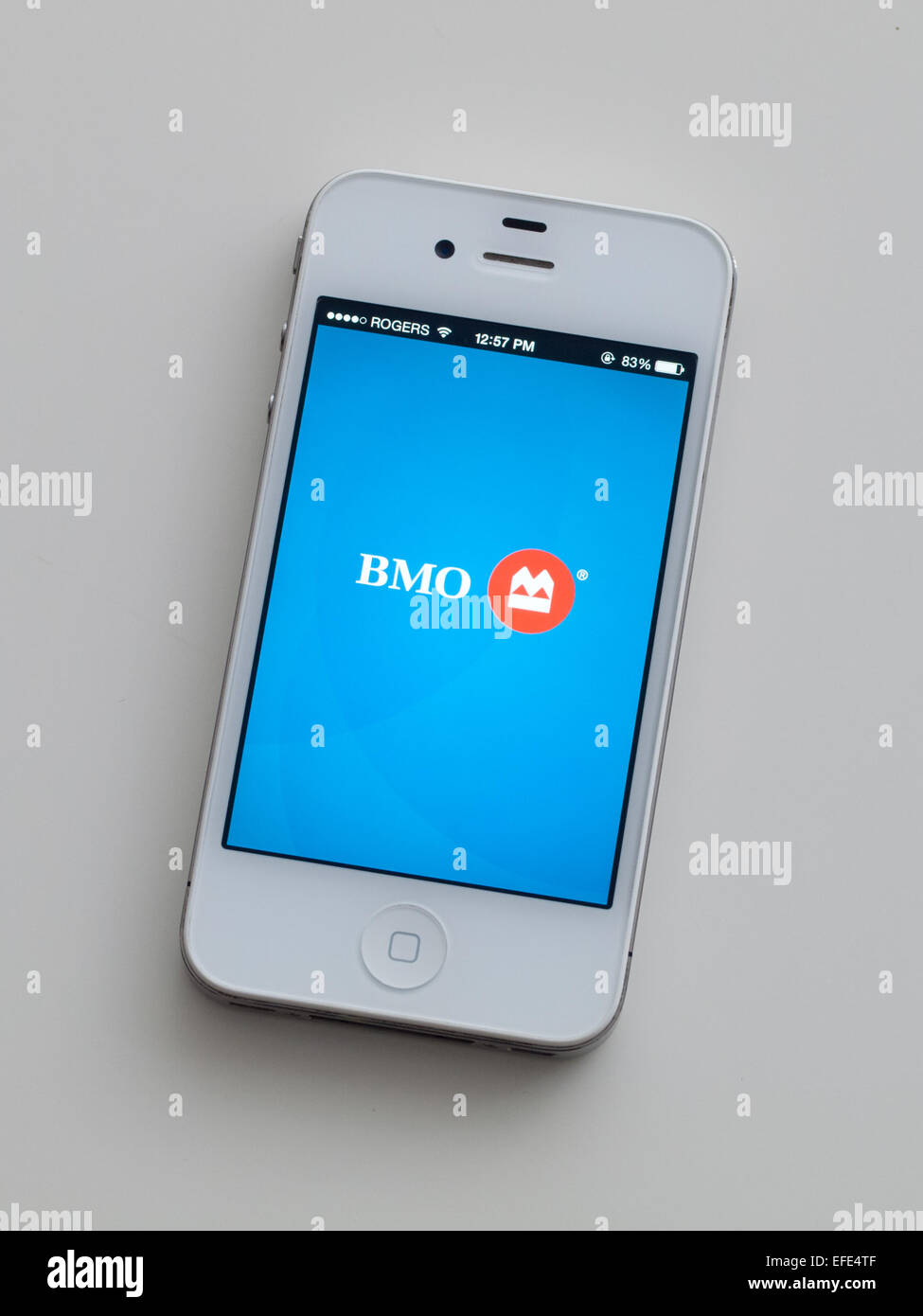 A view of the logo and homescreen of the Bank of Montreal (BMO) mobile app on an Apple iPhone 4. Stock Photo