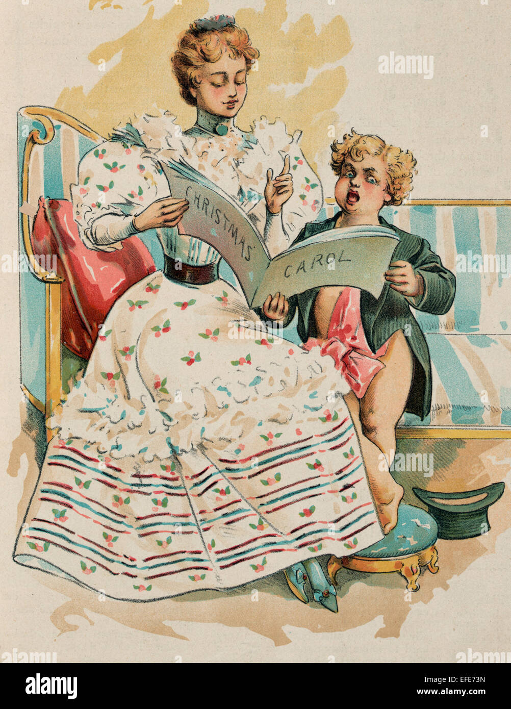 Christmas 1893 -  Puck sitting on a sofa next to a young woman; they are holding a book labeled 'Christmas Carol' and singing. Stock Photo
