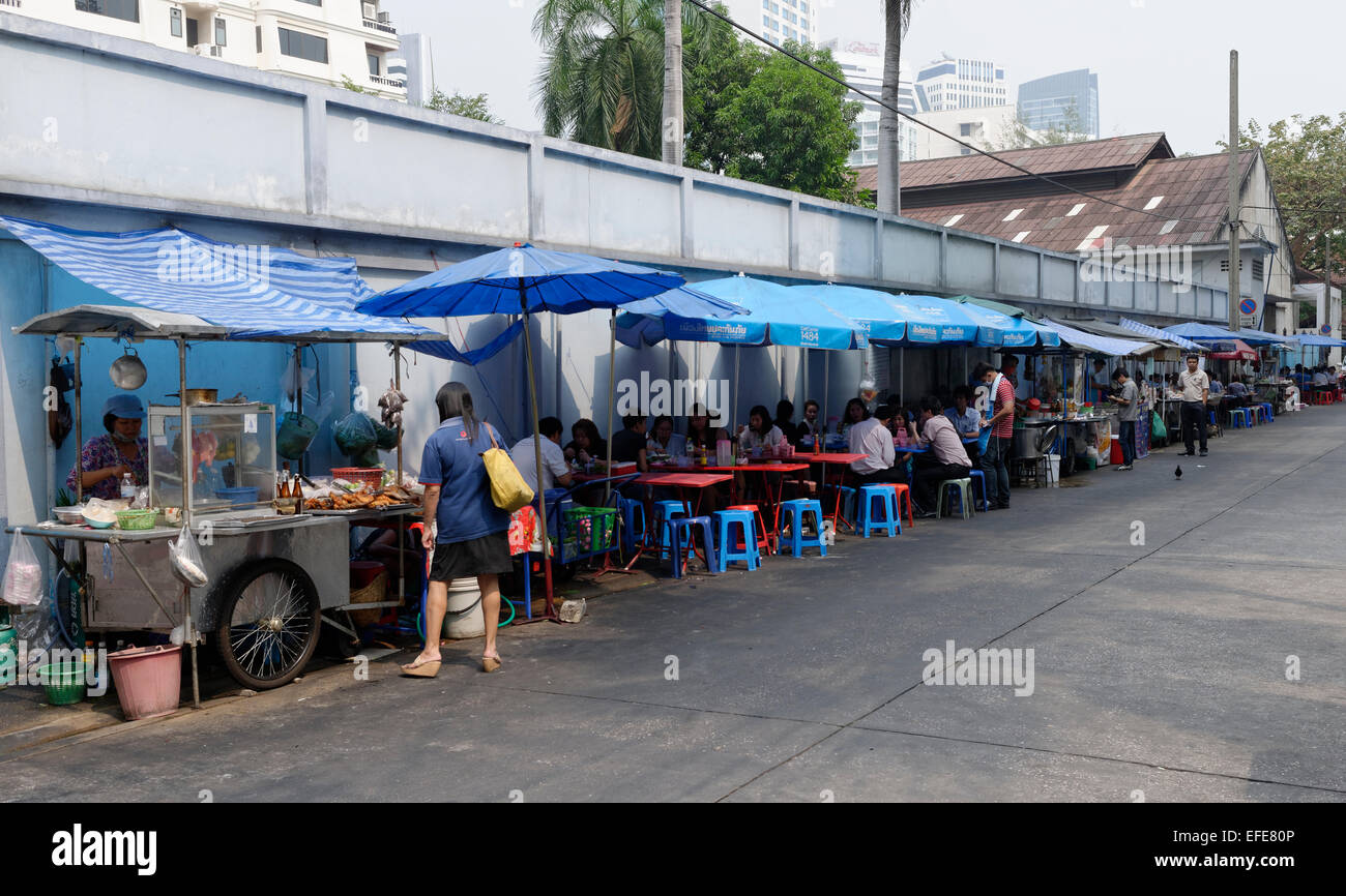 Hawker stalls providing street food by the roadside in Bangkok
