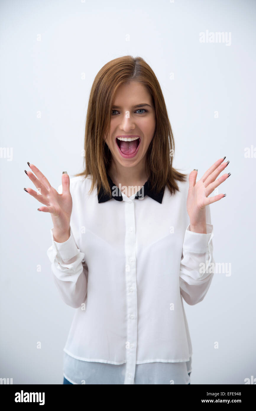 Portrait of a surprised young business woman over gray background Stock ...
